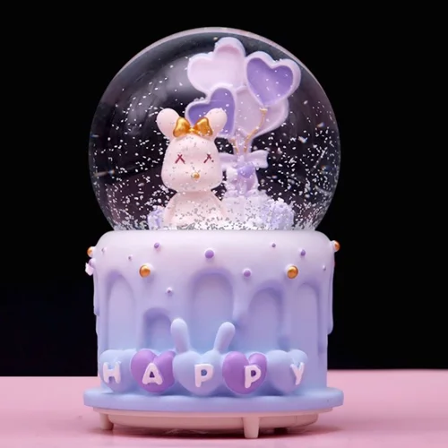 گوی موزیکال برفی پمپی و چراغدار طرح کیک تولد خرگوشی مدل Happy